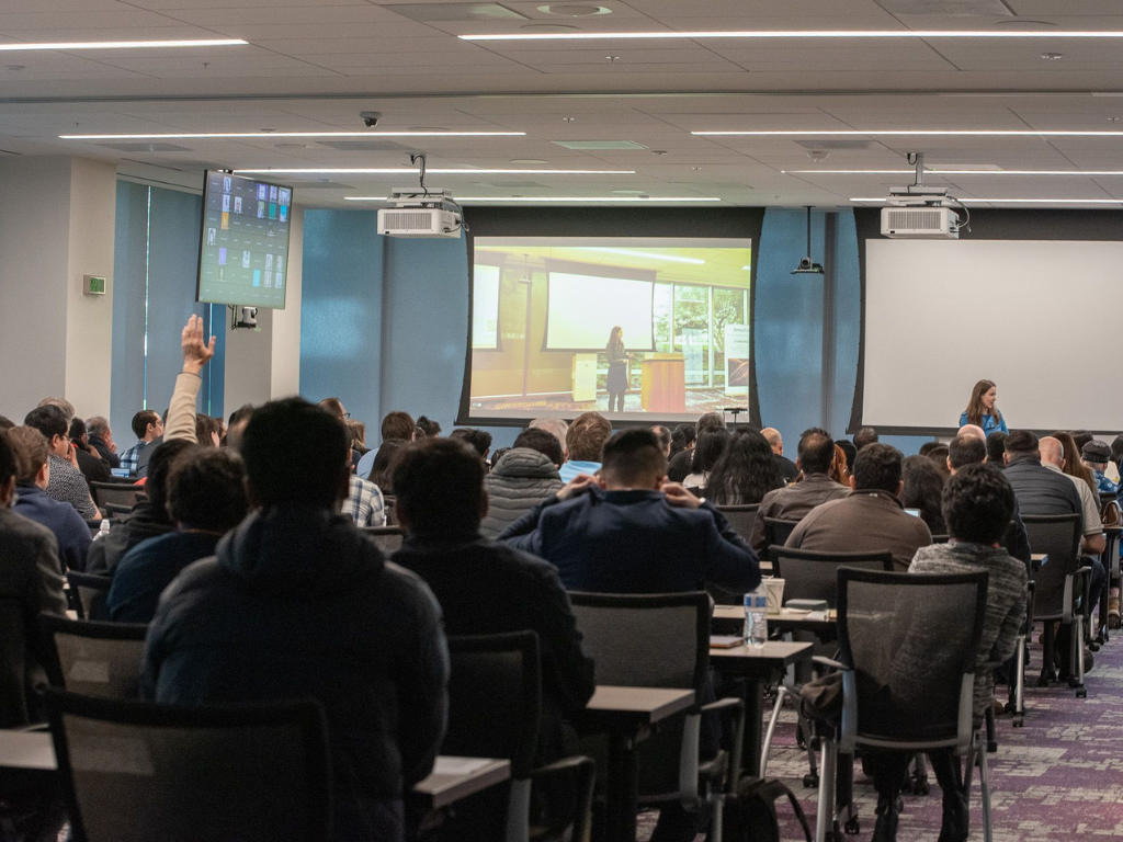Dr. Joan Palmiter Bajorek speaking at an AI Summit