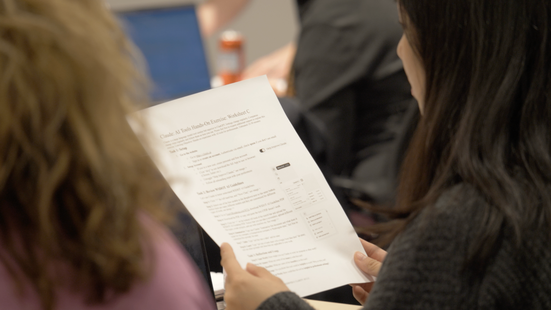 Participant reviewing Claude AI Tools hands-on worksheet