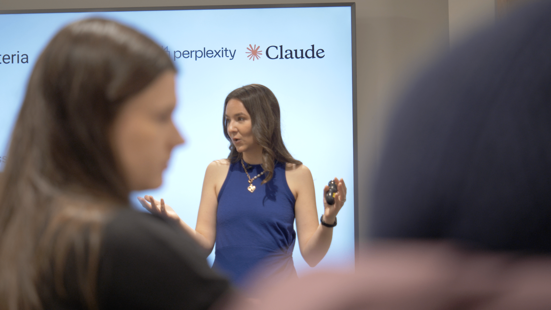 Dr. Joan Palmiter Bajorek presenting a Claude workshop with Perplexity and Claude logos on screen